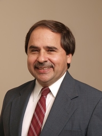 man wearing suit and red tie