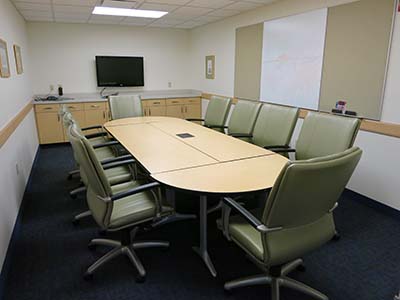 Room with conference table and chairs