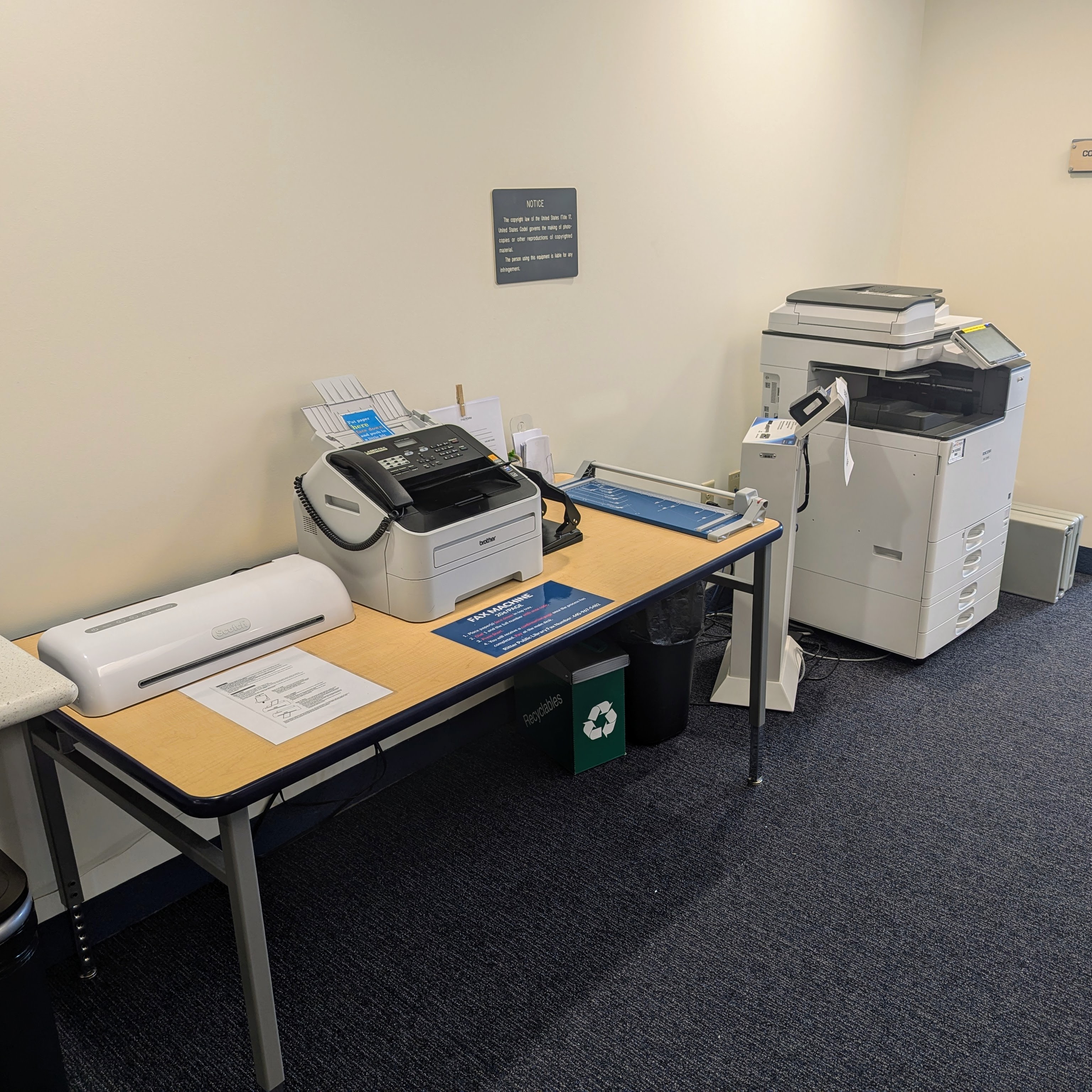 Photo of copier, fax machine, laminator, paper cutter at Ritter Public Library